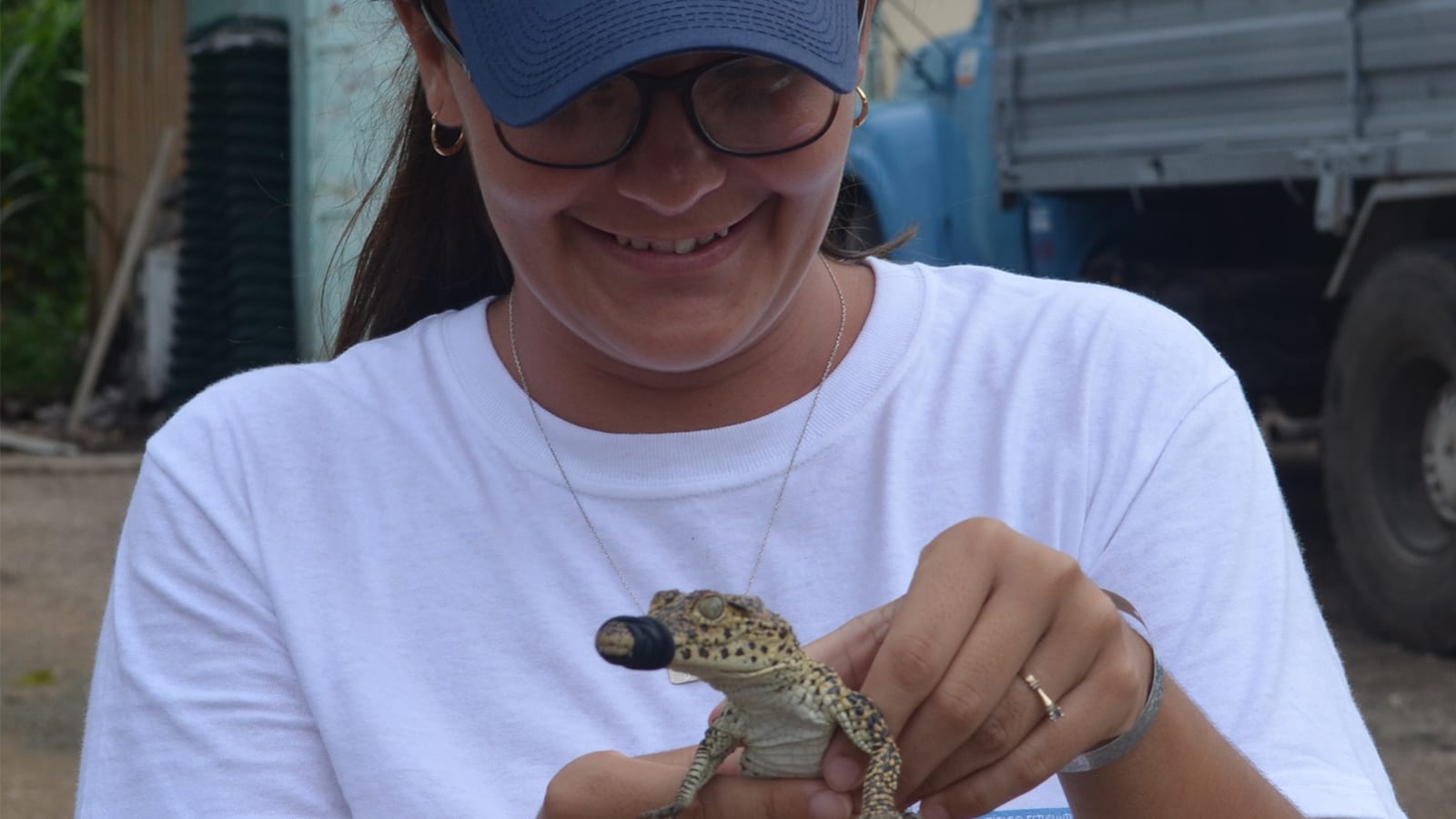 Jessica holds a small reptile